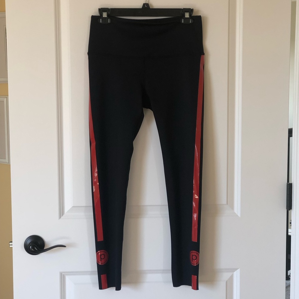 Noli Leggings. Women’s size Large. Black with Red stripes and “p” at the bottom